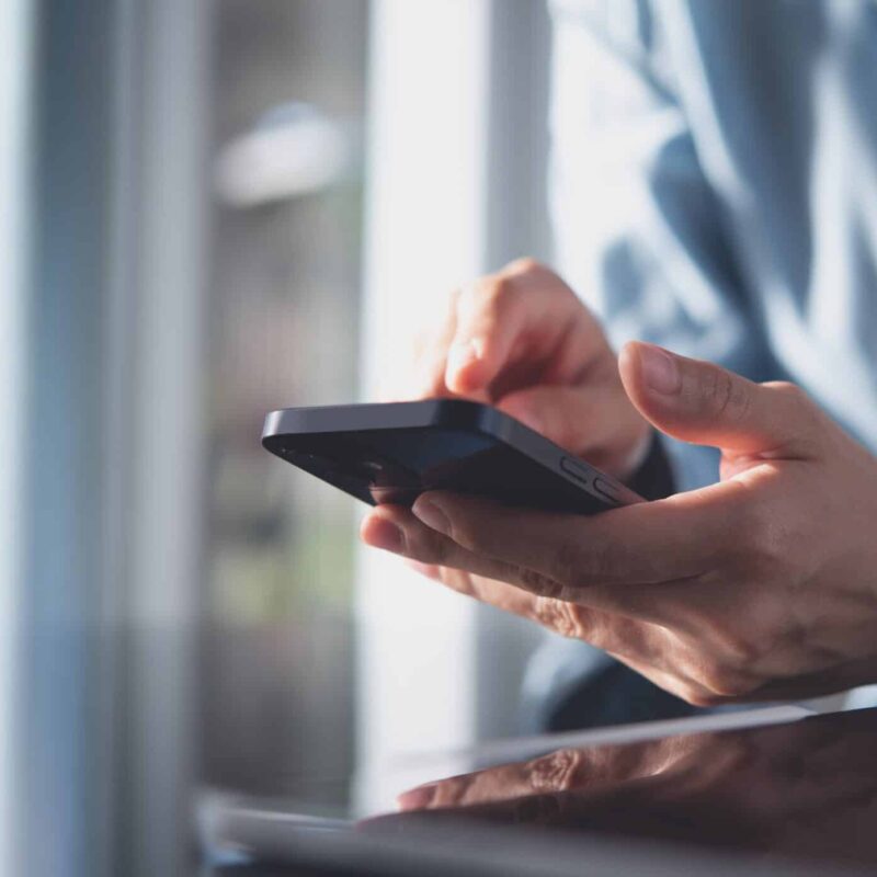 Person looking at cell phone.